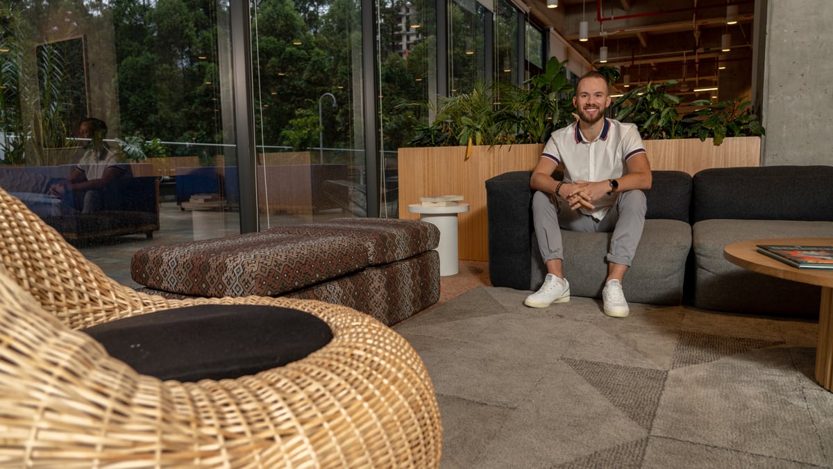 Trevor Davis seated in a WeWork lounge